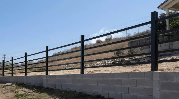 Black aluminium post and rail fence in Yeppoon