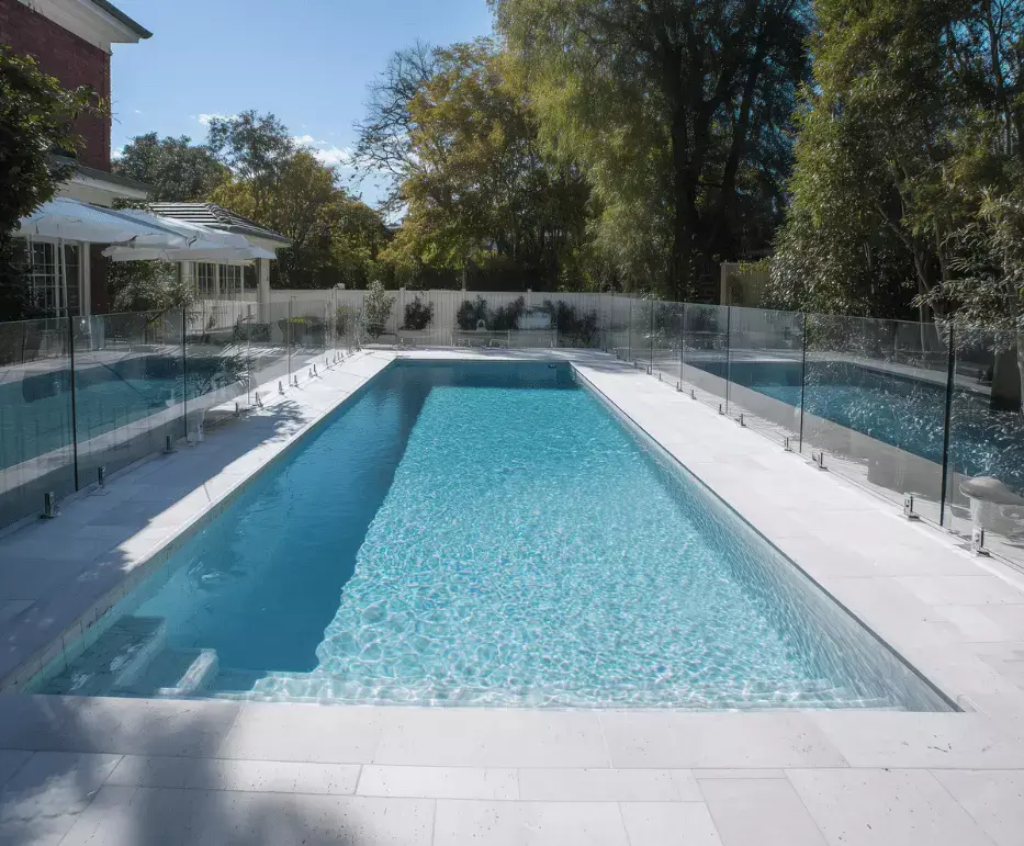 Clear glass fence around backyard pool in Yeppoon